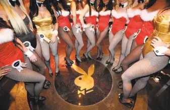  ?? Kin Cheung / Associated Press 2010 ?? Waitresses pose inside the Playboy Club at the Sands Casino in Macau. Playboy founder Hugh Hefner played an important, albeit secondary role, in changing America’s attitudes toward sex.