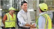  ?? / MILWAUKEE JOURNAL SENTINEL ?? House Speaker Paul Ryan talks with Tom Ruffolo, a MillerCoor­s customer service department manager in the shipping warehouse, on Monday during a visit to the Milwaukee brewery.