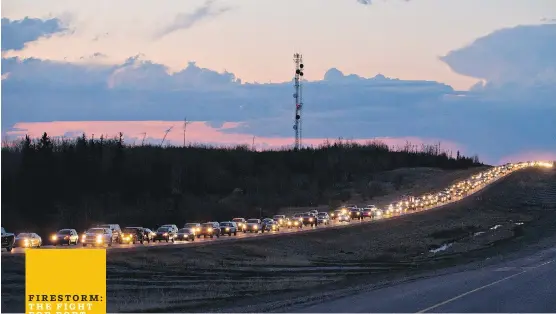  ?? THE CANADIAN PRESS ?? Traffic lined the four lanes of Highway 63 as residents fled Fort McMurray. In the early hours of the evacuation, officials realized there simply wasn’t enough road to get everybody out, so they sent some residents south to Edmonton and others north to the oilsands.