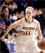  ?? AP/MARK HUMPHREY ?? Arkansas’ Calli Berna (11) drives against Mississipp­i’s Latosha Lewis in the second half of the Razorbacks’ 67-47 victory Thursday at the SEC Women’s Tournament in Nashville, Tenn.