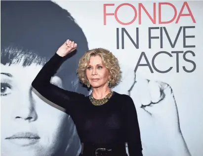  ?? GETTY IMAGES ?? Jane Fonda mimics a protest pose from earlier in her life at a screening for “'Jane Fonda in Five Acts.”