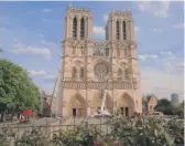  ?? MICHEL EULER/AP ?? Notre Dame Cathedral on Thursday. France paid a daylong tribute to the Paris firefighte­rs who saved the cathedral from collapse.