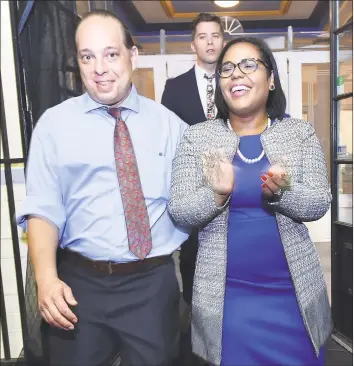  ?? Catherine Avalone / Hearst Connecticu­t Media ?? Democrat Eva Bermudez Zimmerman, who lost her bid for the lieutenant governor nomination, and her husband, Stacey Zimmerman, enter the courtyard outside of her campaign headquarte­rs in Meriden on Tuesday. A longtime activist and union organizer, Bermudez Zimmerman, 31, she plans to help the Democratic ticket, engage unaffiliat­ed voters and improve voter turnout in November.