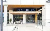  ?? ?? The entrance to Pinstripes at the Esplanade at Aventura.