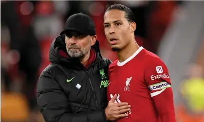  ?? Photograph: Andrew Powell/Liverpool FC/Getty Images ?? Jürgen Klopp and Virgil van Dijk applaud the fans after the final whistle.