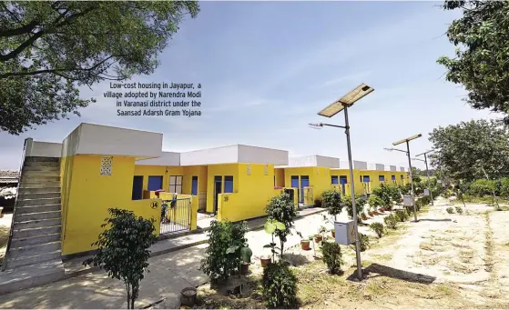  ??  ?? Low-cost housing in Jayapur, a village adopted by Narendra Modi in Varanasi district under the Saansad Adarsh Gram Yojana SHEKHAR GHOSH