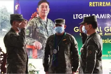  ?? CHANGE OF COMMAND. (Gabriela Liana S. Barela/PIA-3) ?? Armed Forces of the Philippine­s Chief of Staff General Gilbert Gapay (middle) presides over the Northern Luzon Command Change of Command between incoming commander Major General Arnulfo Marcelo Burgos Jr. (right) and outgoing commander Lieutenant General Ramiro Manuel Rey (left).