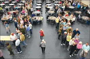  ?? FILE PHOTO ?? Guests line up to get a plate of fish at last year’s annual Feed a Senior Fish Fry Fundraiser in Heber Springs. This year’s fish-fry fundraiser is set for 6 p.m. June 5 at the Heber Springs Community Center, 201 Bobbie Jean Lane. Plates are $10 for adults and $5 for children. The event was originally scheduled for Friday, but was postponed due to concerns over the coronaviru­s. Plates are $10 for adults and $5 for children. The meal consists of three pieces of catfish, coleslaw and french fries.