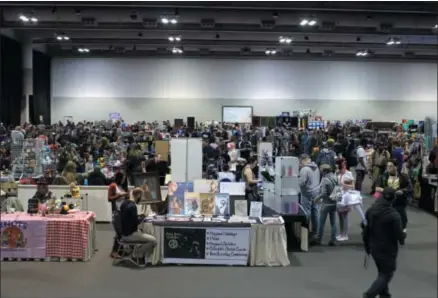  ?? PHOTO FROM HTTP://RETROGAMEC­ON.COM/ ?? RetroGameC­on attendees peruse wares on the exhibition floor at the Oncenter in Syracuse. This year’s RetroGameC­on will be Saturday and Sunday, Nov. 3-4, 2018, from 10a.m. to 6p.m.