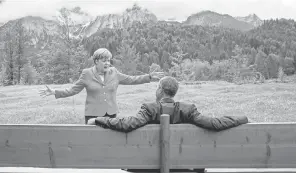  ?? MICHAEL KAPPELER, AP ?? German Chancellor Angela Merkel speaks with President Obama at the Schloss Elmau hotel in Germany during a summit June 8, 2015.