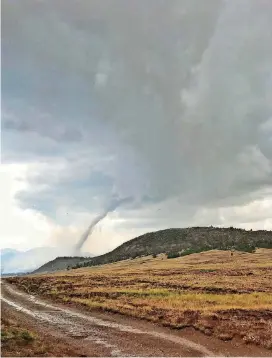  ?? [PHOTO BY MATT MORRIS, WFPD VIA AP] ?? This photo provided by the Wellington Fire Protection District shows a tornado south of Fairplay, Colo., on Thursday. The National Weather Service says the twister touched down Thursday in Park County, south of Fairplay, a central Colorado town about...