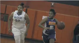  ??  ?? Leonardtow­n’s Kayla Goldring, left, trails Jordan McDuffie of McDonough in Friday evening’s SMAC senior all-star girls basketball game at Chopticon High School in Morganza. Goldring and the Chesapeake Division all-stars fell to McDuffie and the Potomac...