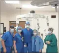  ?? Contribute­d ?? Dr. Bennett Brock and AdventHeal­th Redmond surgical team pose near the da Vinci Xi.