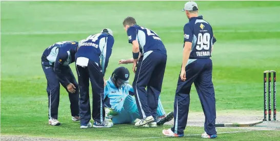  ?? Picture / Getty Images ?? New South Wales opener Daniel Hughes, getting attention after being hit on the helmet, has focused attention on safety. David Leggat