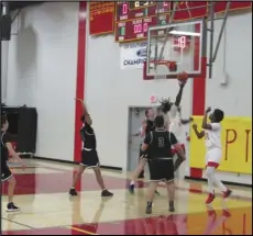  ?? JOHN SANDERS/Valley Press Sports Correspond­ent ?? GLASS — Paraclete senior Amado Coleman drives down the lane and attempts a layup attempt against Burroughs-Ridgecrest in a nonleague game at Paraclete High on Tuesday night. Coleman led the Spirits with 26 points in a 54-51 victory.