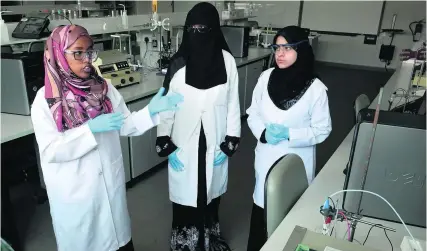  ?? Delores Johnson / The National ?? From left, Salma Abubaker, Zaineb Saeed and Shefaa Abou Namous are three of the four United Arab Emirates University students working in Al Ain to develop a portable device to detect heavy metals and other pollutants in water.