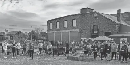  ?? BULL SPIT BREWING CO. ?? People gathered at Bull Spit’s Bull Yard last November for an event. The foundry in the background is where the brewery hoped to open its taproom and brewery, but the project has stretched on for over three years.