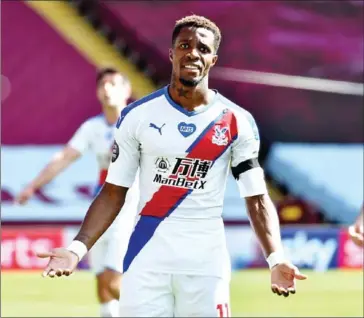  ?? POOL/AFP ?? Crystal Palace forward Wilfried Zaha posted on Twitter three screenshot­s of messages containing racial abuse from an Instagram account belonging to a Villa fan.