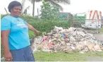  ?? Photo: Kelera Sovasigana­me ?? Vendor, Luisa Vosa points at the pile of rubbish that has been there for almost a month now at
Daniva road in Valelevu.