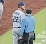  ?? K.C. Alfred San Diego Union-Tribune ?? CLAYTON KERSHAW gets angry with a call and the Padres’ Jurickson Profar.