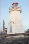  ?? GREG MCNEIL/CAPE BRETON POST ?? The Gabarus Lighthouse is shown in its new location on a frost wall that is 40 feet from its former location. Erosion of a cliffside had placed the structure in jeopardy before the move.