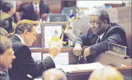  ?? Review-journal file ?? State Sens. Bill Raggio, R-reno, and Joe Neal, D-north Las Vegas, confer in 2001 during a recess on the Senate floor in Carson City.