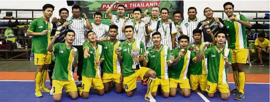  ??  ?? Well worth the trip: The Malaysian Under-16 team celebratin­g their win in the Milo Hidup Bola Futsal Championsh­ip for the third time in a row in Pattaya, Thailand, yesterday.