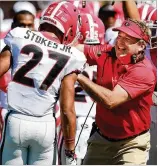  ?? CURTIS COMPTON/CCOMPTON@AJC.COM ?? Georgia coach Kirby Smart celebrates with Eric Stokes on Saturday after he blocked a punt and returned it for a TD.