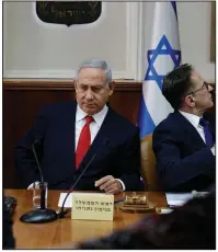  ?? AP/ARIEL SCHALIT ?? Israeli Prime Minister Benjamin Netanyahu holds his weekly Cabinet meeting Sunday in Jerusalem, announcing strikes on Iranian and Hezbollah sites in Syria while praising his departing military chief of staff.
