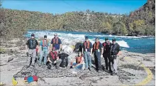  ?? KIP FINN, SPECIAL TO THE REVIEW ?? Workers hauled 1,000 pounds of accumulate­d garbage from the Niagara Gorge near the Whirlpool Aero Car earlier this week.