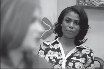  ?? The Associated Press ?? FORMER EMPLOYEE: In this Feb. 14, 2017, file photo, Omarosa Manigault-Newman, then an aide to President Donald Trump, watches during a meeting with parents and teachers in the Roosevelt Room of the White House in Washington. The White House is slamming a new book by ex-staffer Omarosa Manigault-Newman, calling her “a disgruntle­d former White House employee.”