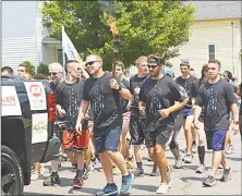  ?? Cassandra Day / Hearst Connecticu­t Media / ?? More officers and civilians than ever took part in leg three of the three-day annual Law Enforcemen­t Torch Run for Special Olympics Connecticu­t. The opening ceremonies for the Special Olympics Connecticu­t Summer Games are tonight in New Haven.