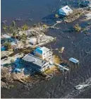  ?? GERALD HERBERT/AP ?? The bridge leading from Fort Myers to Pine Island is seen heavily damaged in the aftermath of Hurricane Ian on Pine Island on Oct. 1. Florida Legislatur­e is meeting this week for a special session on property insurance and property tax relief in the wake of damage caused by Hurricane Ian.