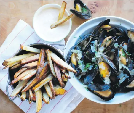  ?? ERIC AKIS ?? Moules frites is a bistro classic you can easily make at home. Don’t start cooking the mussels until the frites are halfway done.