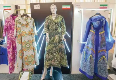  ?? ?? This photograph shows creations displayed during the annual exhibition on fashion and clothes designed by young Iranian designers, at the Sadabad Palace Complex, north of the Iranian capital Tehran. — AFP photos