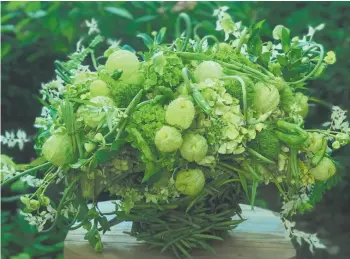  ?? Washington Post photo ?? Laura Dowling says her “green bean casserole” bouquet is good to send to a loved one who lives far away, signifying nostalgia, comfort and family.