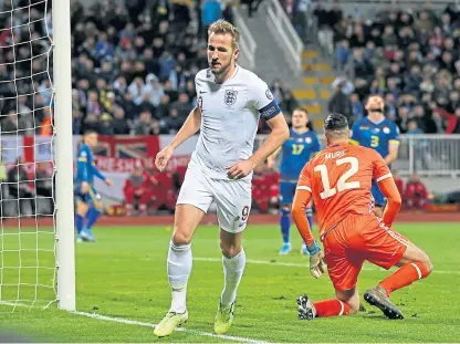  ?? Picture: PA. ?? Harry Kane wheels away after scoring his goal – and England’s second – in Pristina.