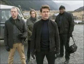  ?? DAVID JAMES — PARAMOUNT PICTURES AND SKYDANCE VIA THE ASSOCIATED PRESS ?? From left, Simon Pegg, Rebecca Ferguson, Tom Cruise and Ving Rhames appear in a scene from “Mission: Impossible - Fallout.”