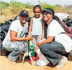  ??  ?? Twain Harrison, senior operations analyst, GK Insurance, and Tamika Harrison, technical officer of Allied Insurance Brokers Ltd, and their daughter, Tianna, make it a family affair.