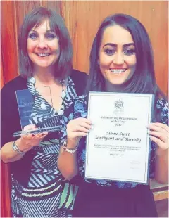  ??  ?? Annie Ives, left, and Amy Magill with the Edge Hill University award