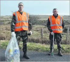  ?? (Photo: Katie Glavin) ?? Steve McDonagh and Shane Maher participat­ing in the clean up of ‘the triangle’ near the Kilworth ranges.