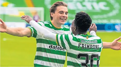  ?? Picture: SNS. ?? James Forrest celebratin­g with Jeremie Frimpong during the match against Hamilton.