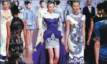  ?? XINHUA ?? NE·Tiger 2014 Haute Couture show in Beijing (2013).