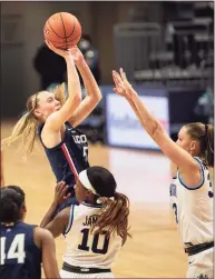  ?? Laurence Kesterson / Associated Press ?? UConn guard Paige Bueckers (5) shoots over Villanova forward Sarah Mortensen on Tuesday.