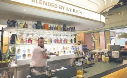  ?? Picture: AFP ?? RIGHT MOVES. Lebanese bartender Hadi Ghassan prepares a drink behind the counter at Meraki Riyadh, a pop-up bar offering nonalcohol­ic bellinis and spritzes, served in chilled cocktail glasses.