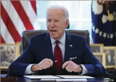  ?? EVAN VUCCI
AP PHOTO/ ?? In this Jan. 28 2021 file photo, President Joe Biden signs a series of executive orders in the Oval Office of the White House in Washington. Biden campaigned on raising the national minimum wage to $15 per hour and attached a proposal doing just that to the $1.9 trillion coronaviru­s pandemic relief bill.