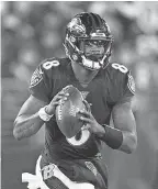  ?? TOMMY GILLIGAN/ USA TODAY SPORTS ?? Ravens quarterbac­k Lamar Jackson passed for 163 yards and one touchdown and rushed for two TDs against the Patriots.