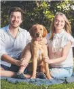  ?? Picture: AAP ?? Jack Batty and Charlotte Thomas with their six-month-old dog, Trooper.