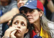  ?? ARIANA CUBILLOS / ASSOCIATED PRESS ?? Anti-government demonstrat­ors attend a vigil Monday in honor of those killed in clashes with security forces in Caracas, Venezuela.