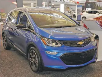  ?? GENE J. PUSKAR/ AP ?? A 2020 Chevrolet Bolt EV is displayed at the Pittsburgh Internatio­nal Auto Show in February. GM’s new electric- vehicle batteries will hold twice as much energy as current ones, the company says.